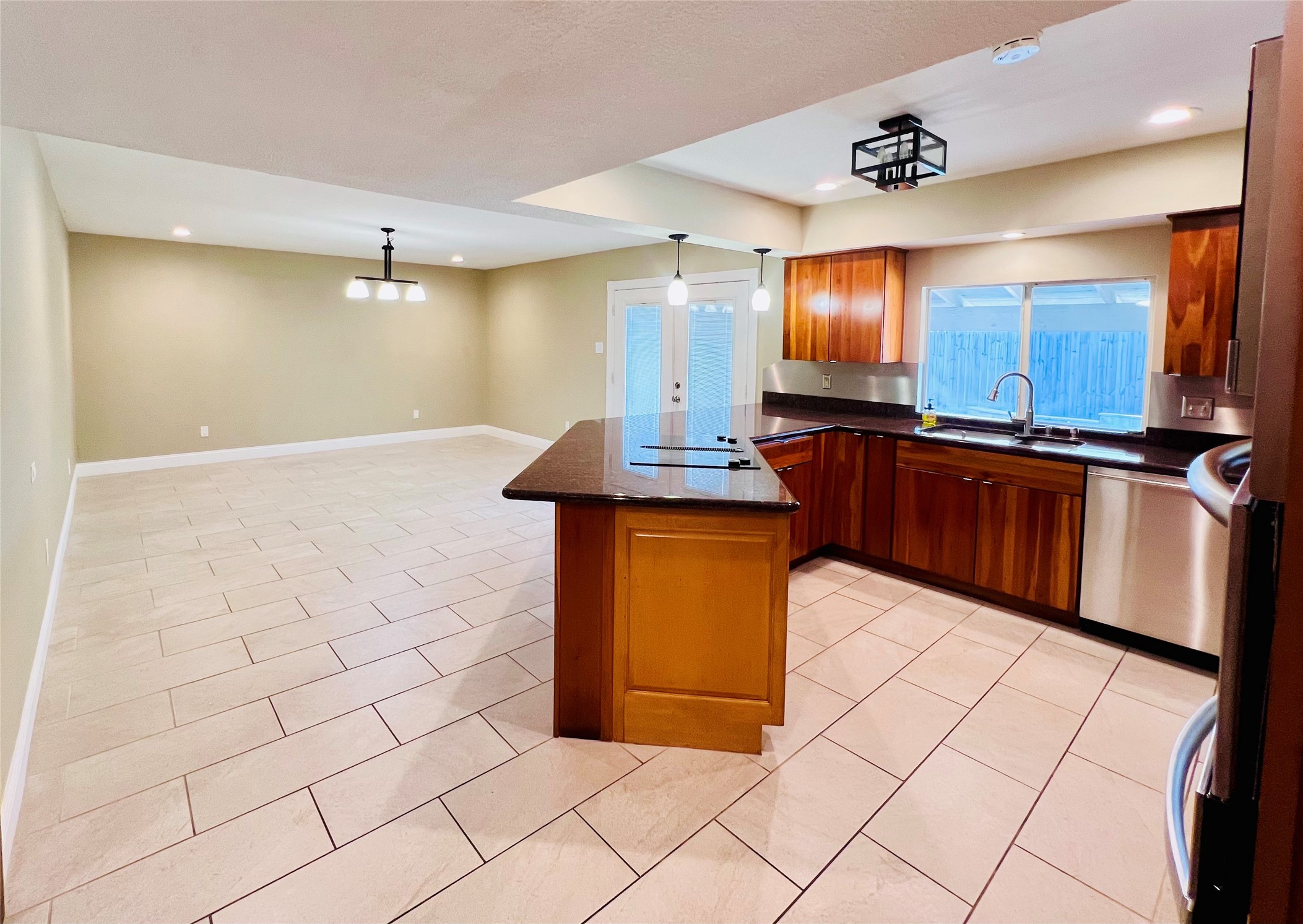 2602 Killdeer Lane Humble, TX 77396 - Photo 6 of 8 An entertainers dream: The open-concept design blends kitchen and living space with quick access to the backyard.