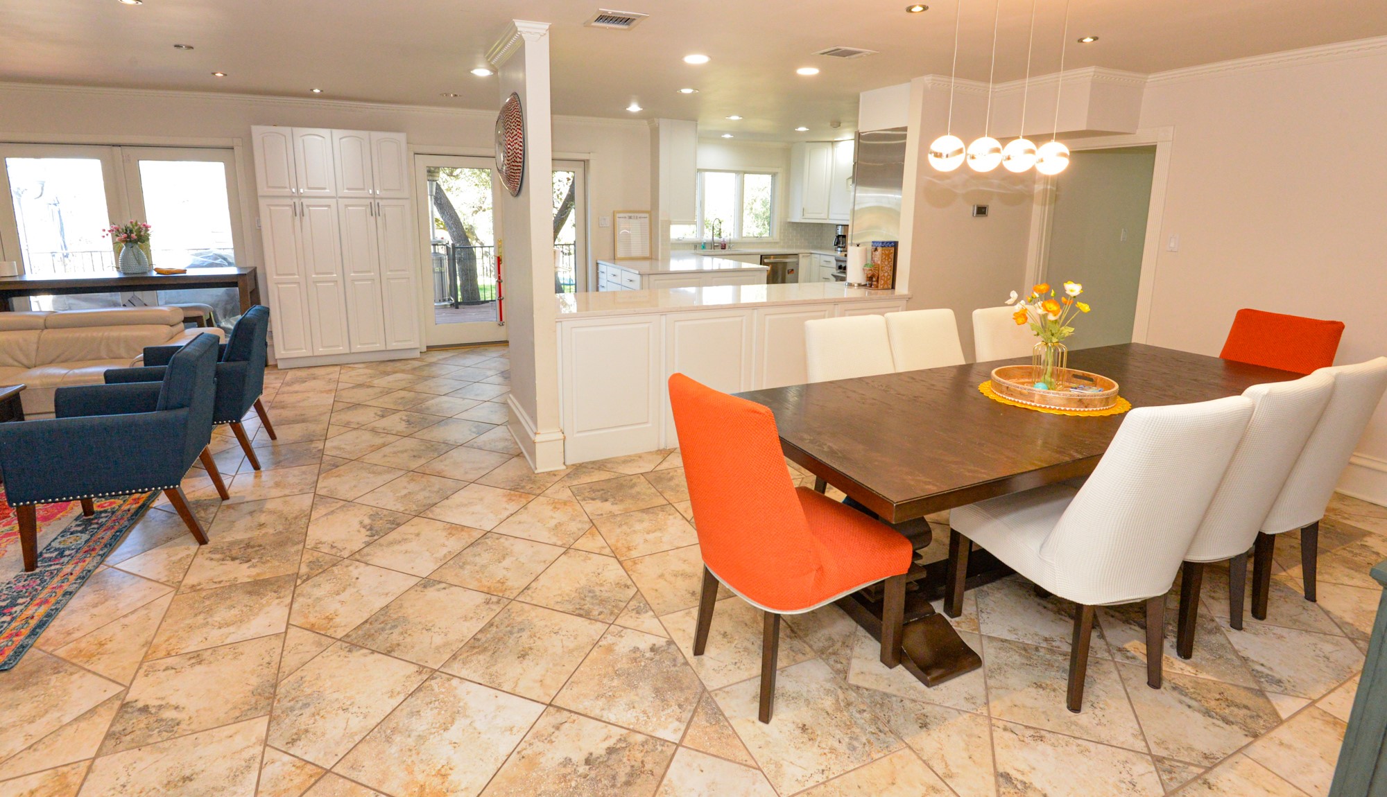 10710 D-K Ranch Road Austin, TX 78759 - Photo 13 of 34 Natural light illuminates the tile flooring and spacious open-concept design.