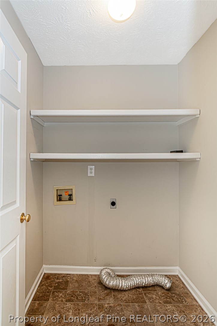 7787 Trappers Road Fayetteville, NC 28311 - Photo 17 of 47 a view of room with racks on the wall