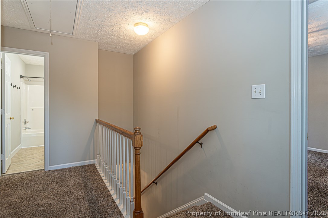 7787 Trappers Road Fayetteville, NC 28311 - Photo 20 of 47 a view of hallway with stairs