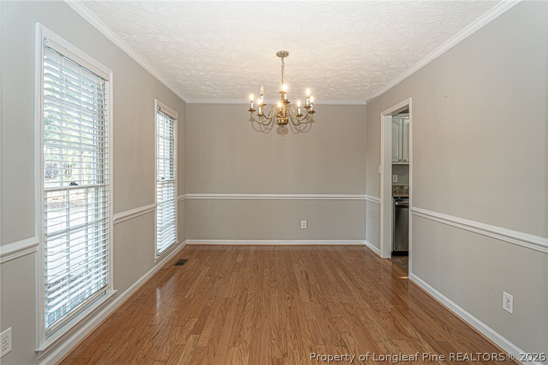 7787 Trappers Road Fayetteville, NC 28311 - Photo 4 of 47 a view of a livingroom with wooden floor