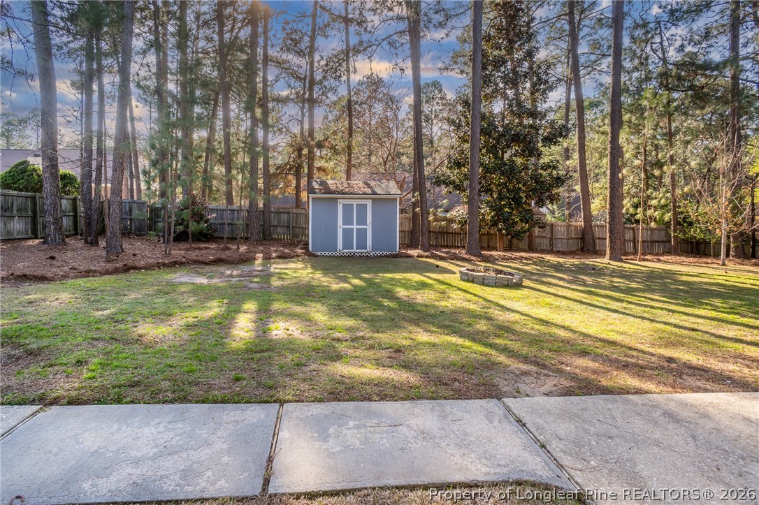 7787 Trappers Road Fayetteville, NC 28311 - Photo 42 of 47 a view of a swimming pool with an outdoor space and seating area