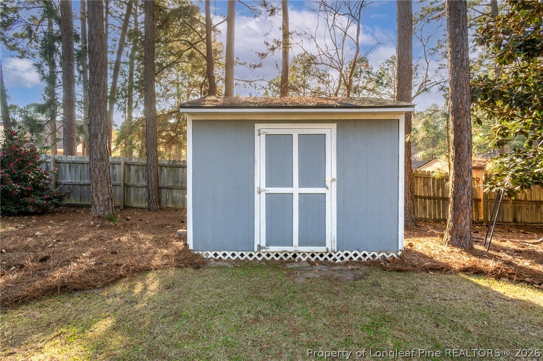7787 Trappers Road Fayetteville, NC 28311 - Photo 45 of 47 a view of a house with a wooden fence