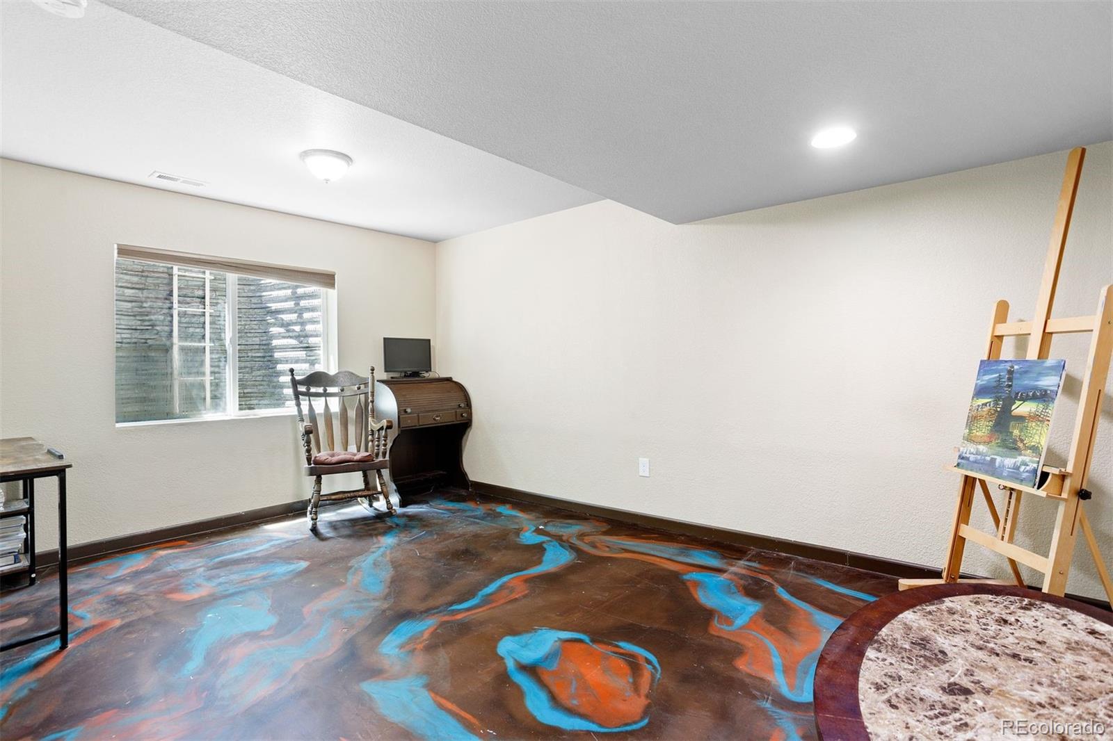 2556 Hannah Ridge Drive Colorado Springs, CO 80922 - Photo 17 of 39 a living room with a bed furniture and a window