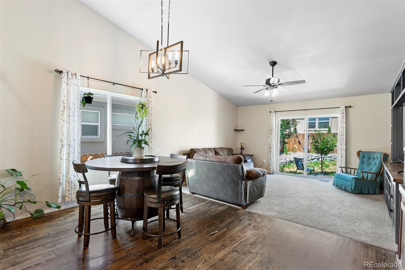 2556 Hannah Ridge Drive Colorado Springs, CO 80922 - Photo 2 of 39 a view of a livingroom with furniture window and wooden floor