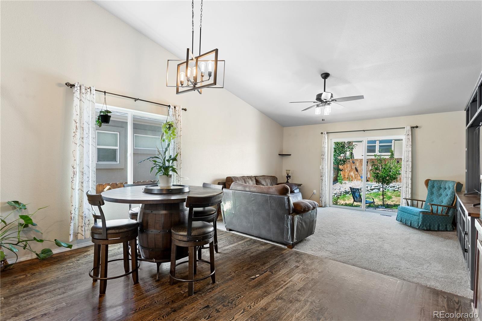 2556 Hannah Ridge Drive Colorado Springs, CO 80922 - Photo 29 of 39 a view of a livingroom with furniture window and wooden floor