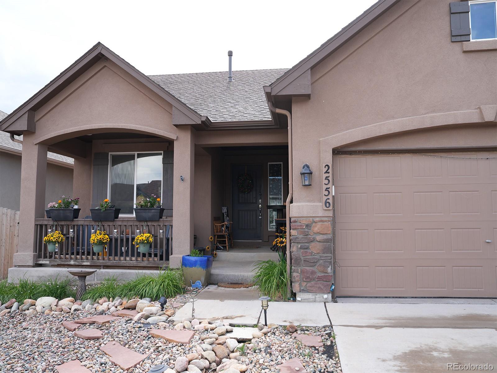 2556 Hannah Ridge Drive Colorado Springs, CO 80922 - Photo 31 of 39 a front view of a house with a porch