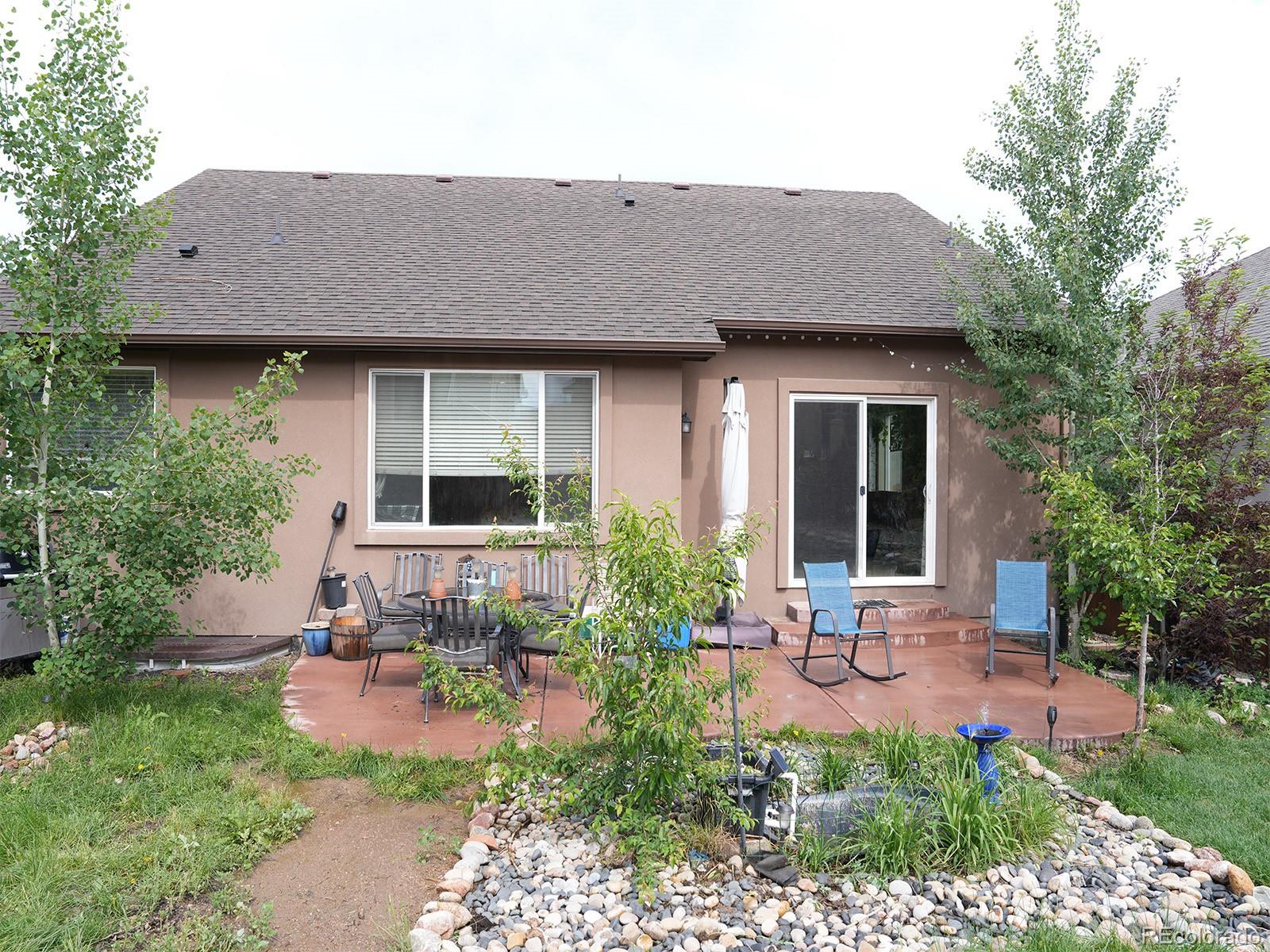2556 Hannah Ridge Drive Colorado Springs, CO 80922 - Photo 34 of 39 a house view with a garden space