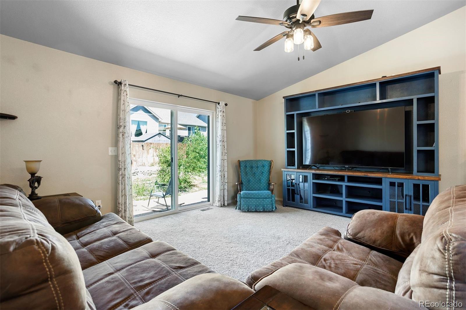 2556 Hannah Ridge Drive Colorado Springs, CO 80922 - Photo 5 of 39 a living room with furniture and a flat screen tv