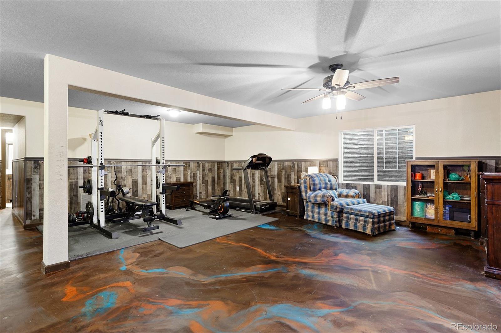 2556 Hannah Ridge Drive Colorado Springs, CO 80922 - Photo 7 of 39 a view of living room with workspace and a window