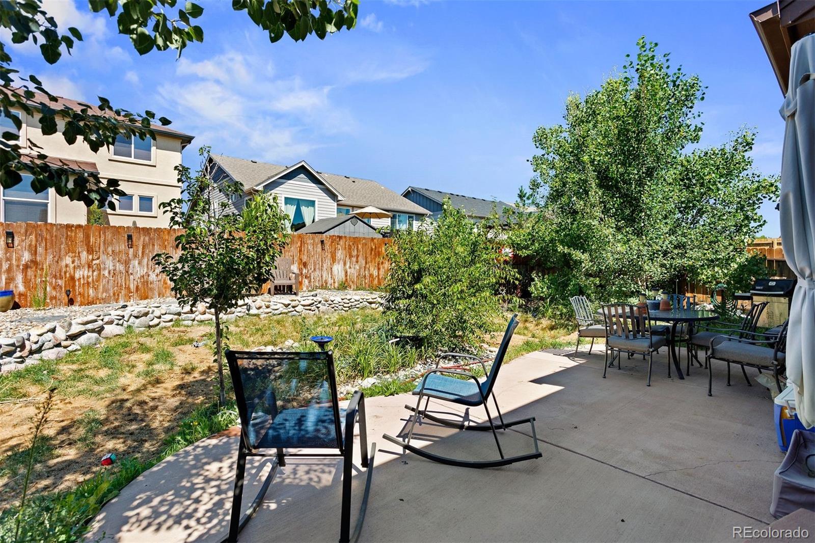 2556 Hannah Ridge Drive Colorado Springs, CO 80922 - Photo 10 of 39 a view of a chairs and table in a patio