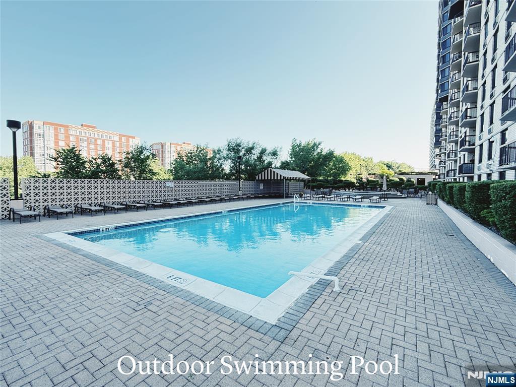 1265 15th Street, Unit 1A Fort Lee, NJ 07024 - Photo 13 of 14 a view of a lake with a large building