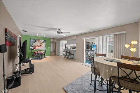 a view of a livingroom with furniture and a flat screen tv
