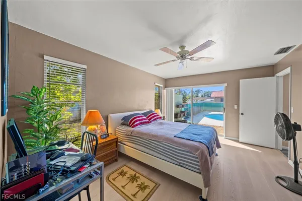a bathroom with a double vanity sink toilet and shower