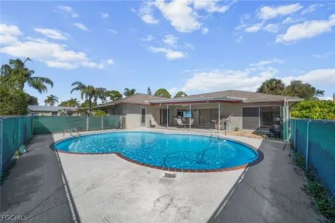 a view of a swimming pool with a patio