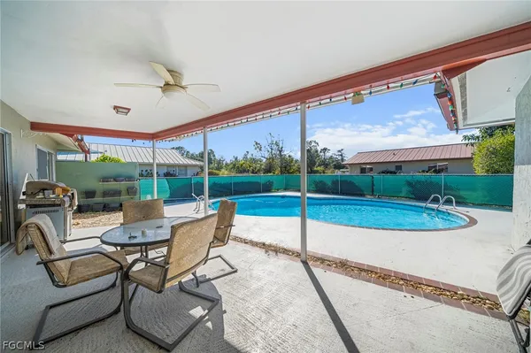 a building outdoor space with patio furniture and garden