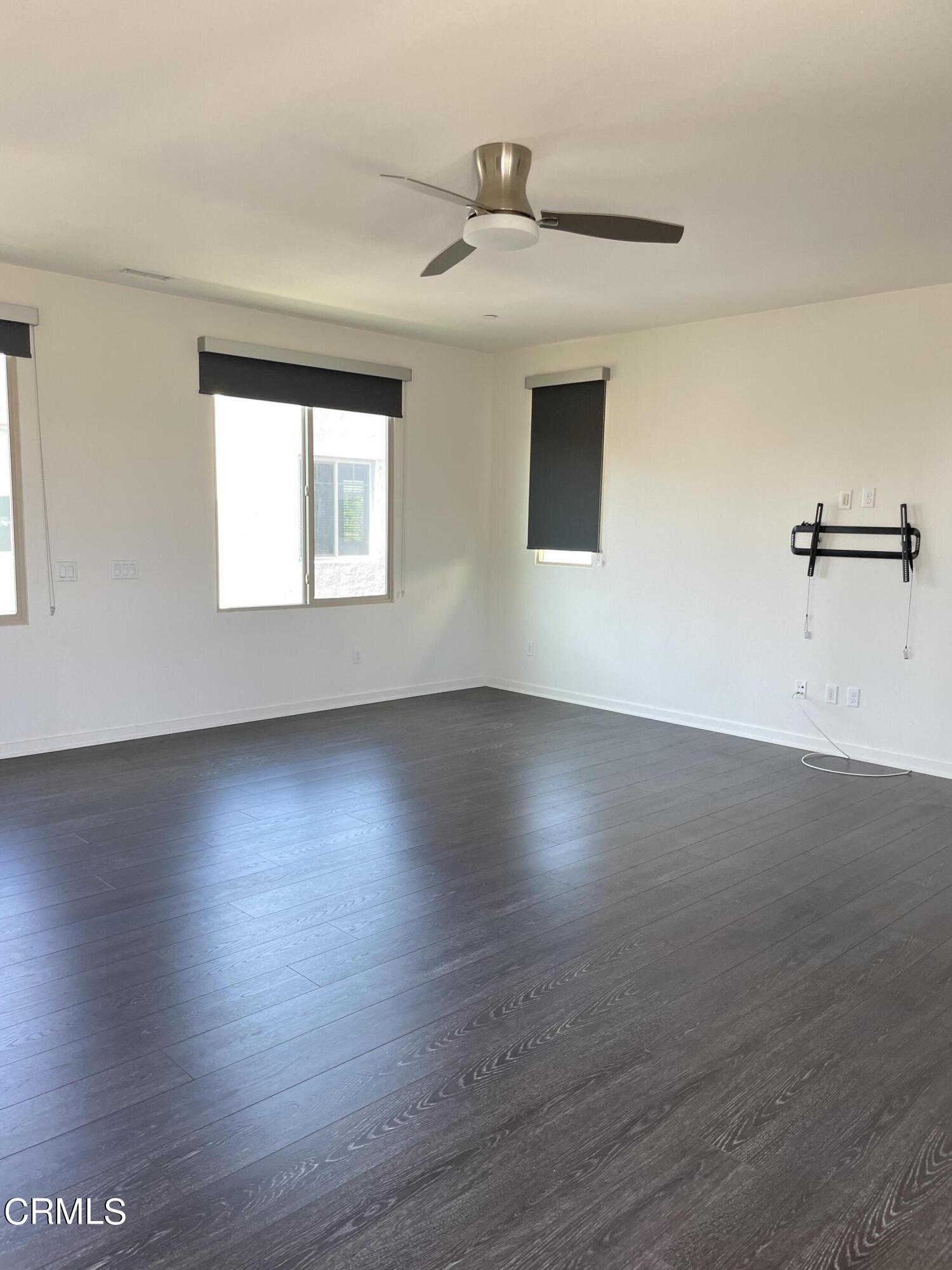 5524 Palm Drive Hawthorne, CA 90250 - Photo 19 of 46 an empty room with wooden floor and windows