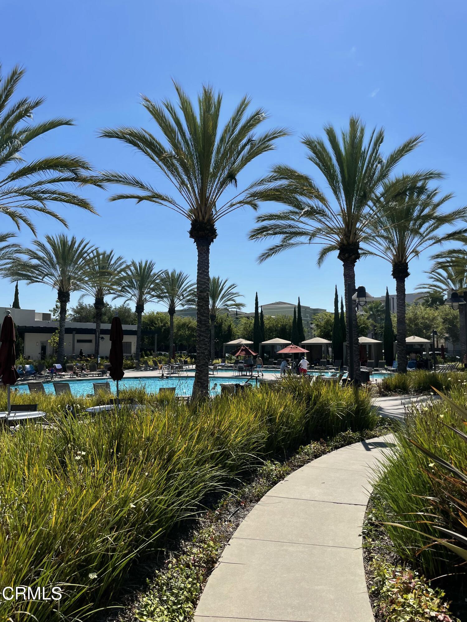 5524 Palm Drive Hawthorne, CA 90250 - Photo 26 of 46 a view of a swimming pool with a table and chairs
