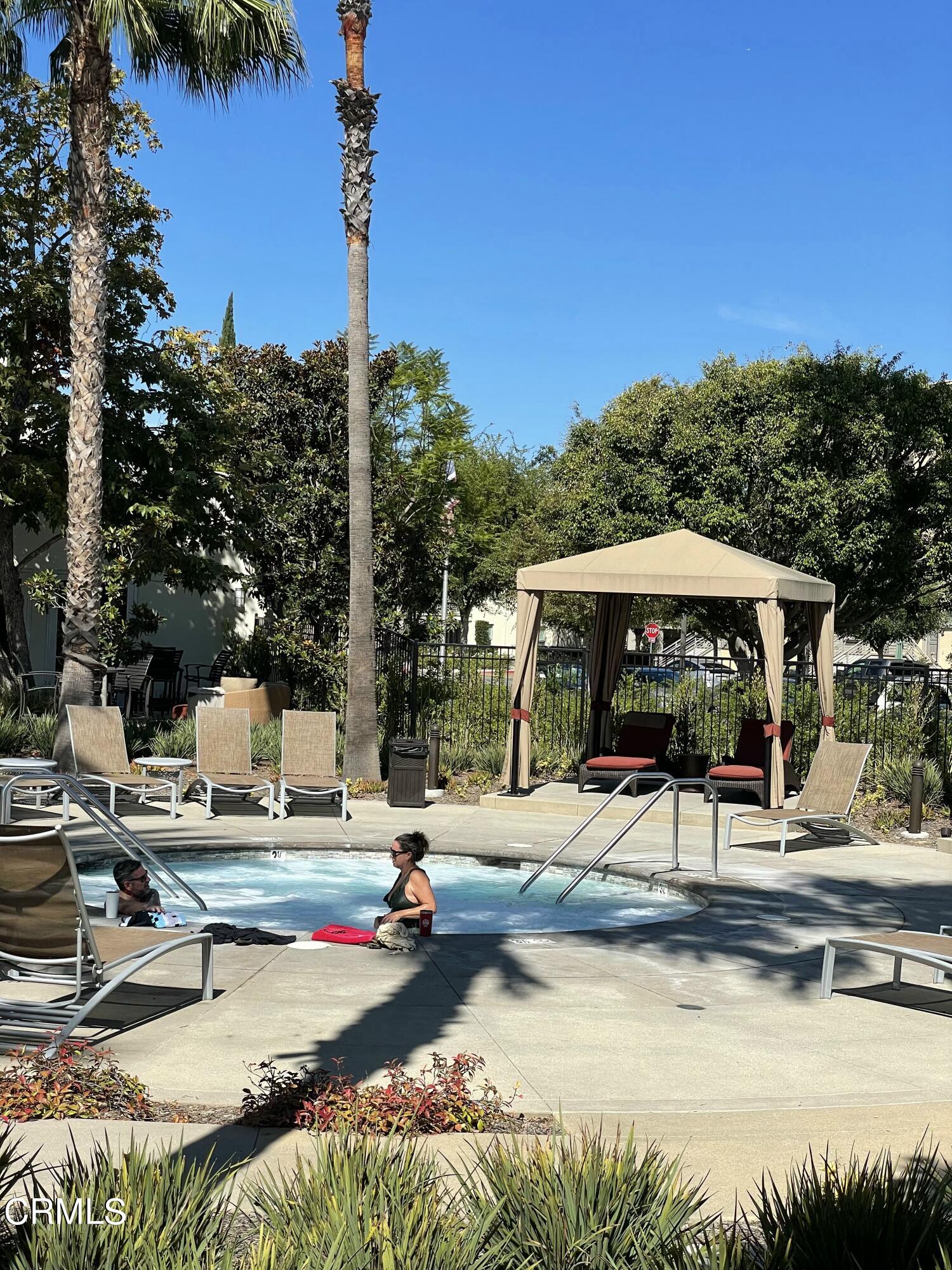 5524 Palm Drive Hawthorne, CA 90250 - Photo 36 of 46 a view of a swimming pool with a lounge chairs