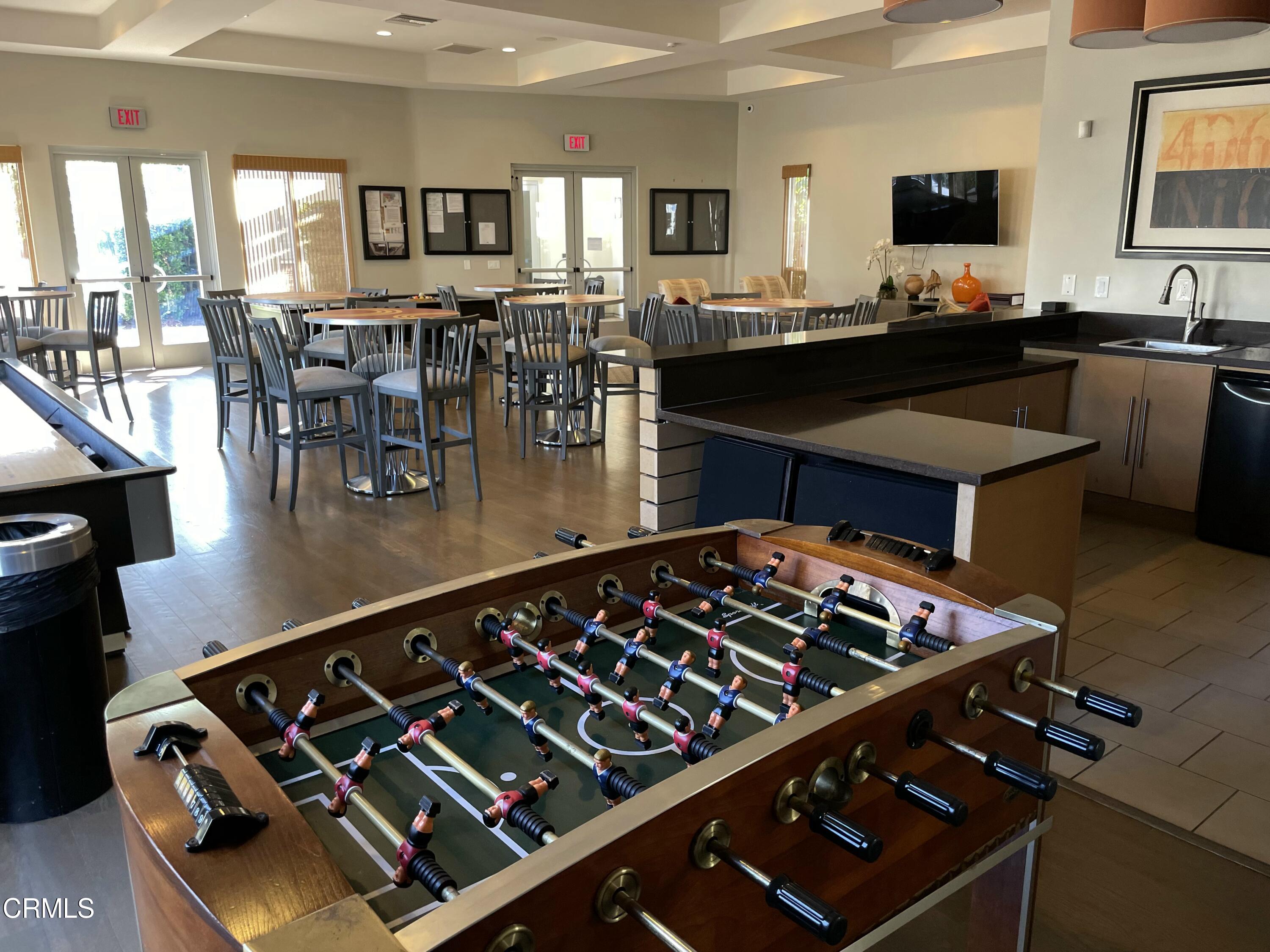 5524 Palm Drive Hawthorne, CA 90250 - Photo 43 of 46 a kitchen with a stove a sink a dining table and chairs