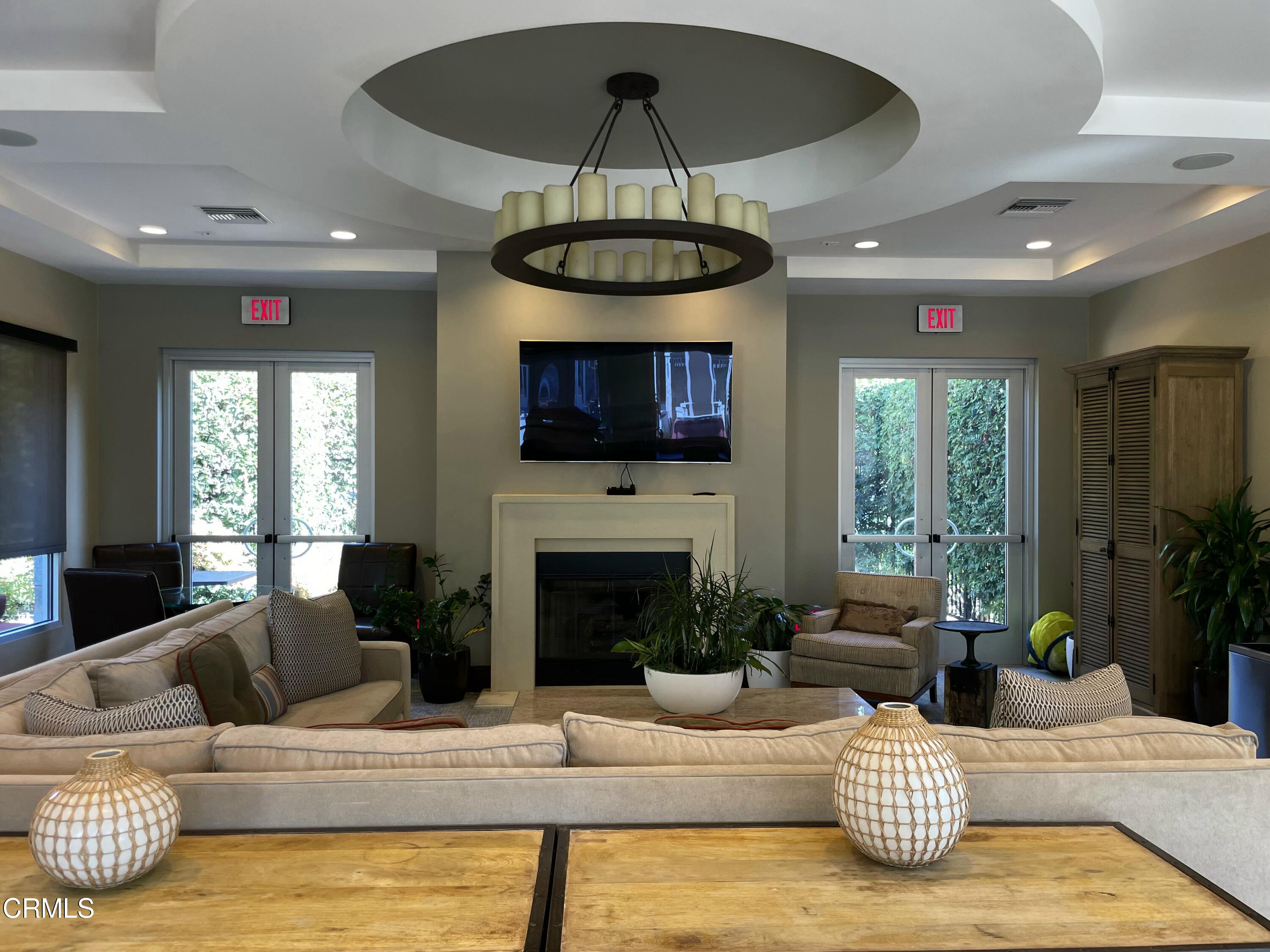 5524 Palm Drive Hawthorne, CA 90250 - Photo 44 of 46 a living room with furniture a fireplace and a chandelier