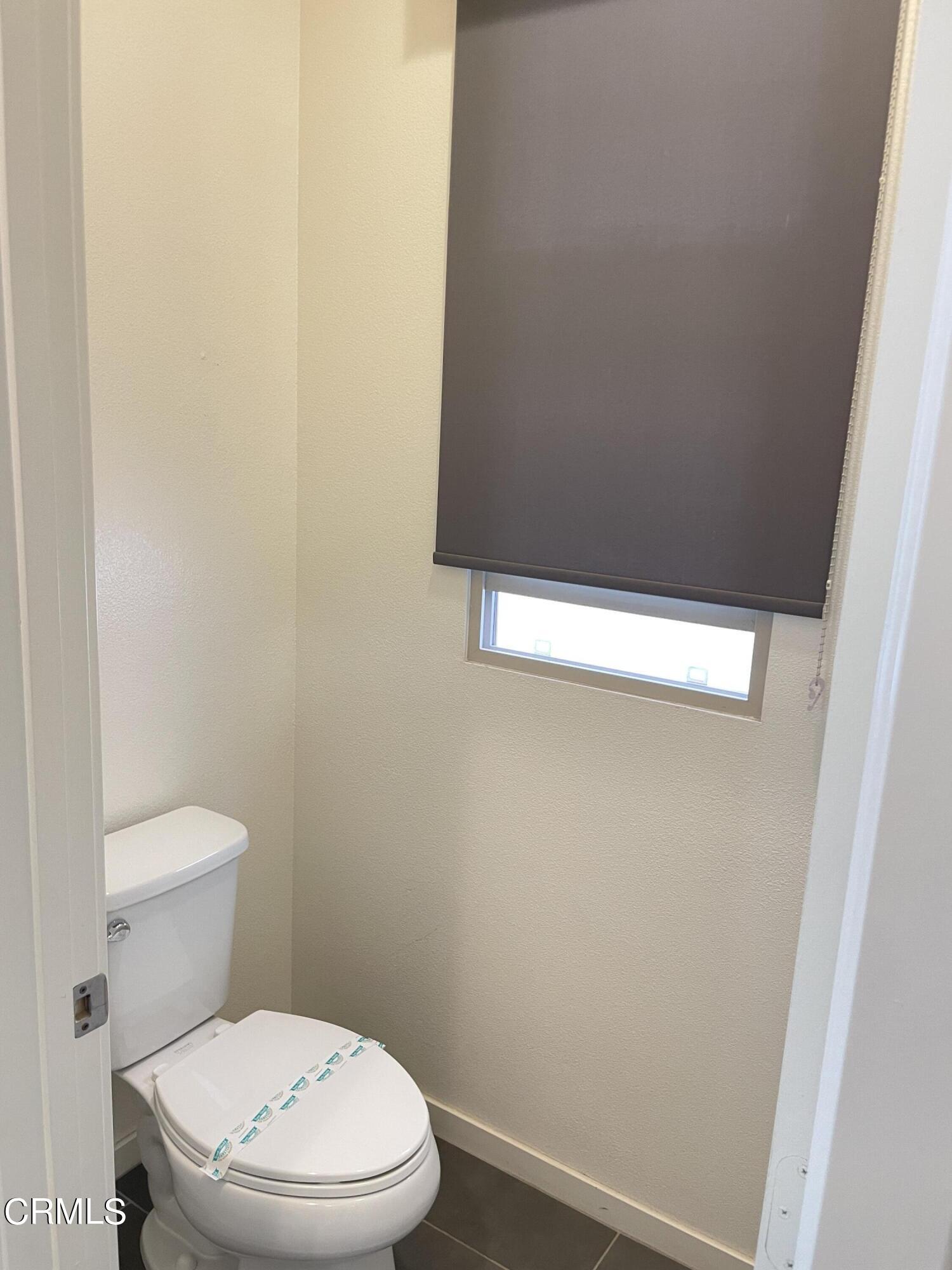 5524 Palm Drive Hawthorne, CA 90250 - Photo 6 of 46 a white toilet sitting next to a white wall