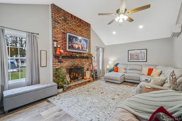a living room with furniture and a fireplace