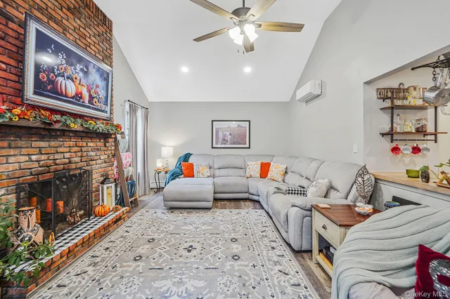 a living room with furniture and a fireplace