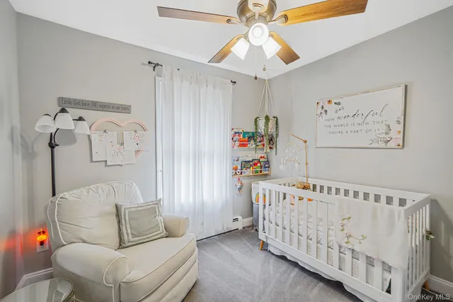 a bedroom with furniture and a chandelier