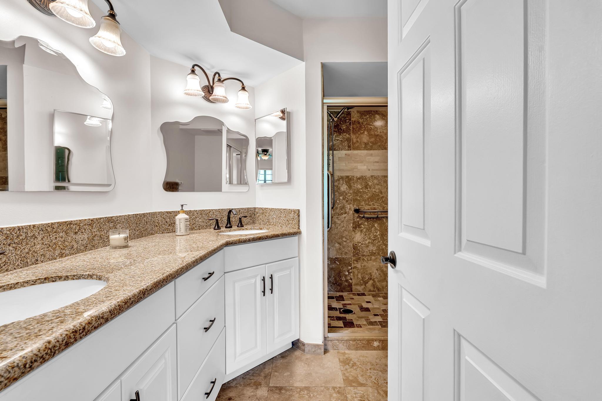 17372 Boca Club Boulevard, Unit 405 Boca Raton, FL 33487 - Photo 41 of 74 a bathroom with a sink and a mirror