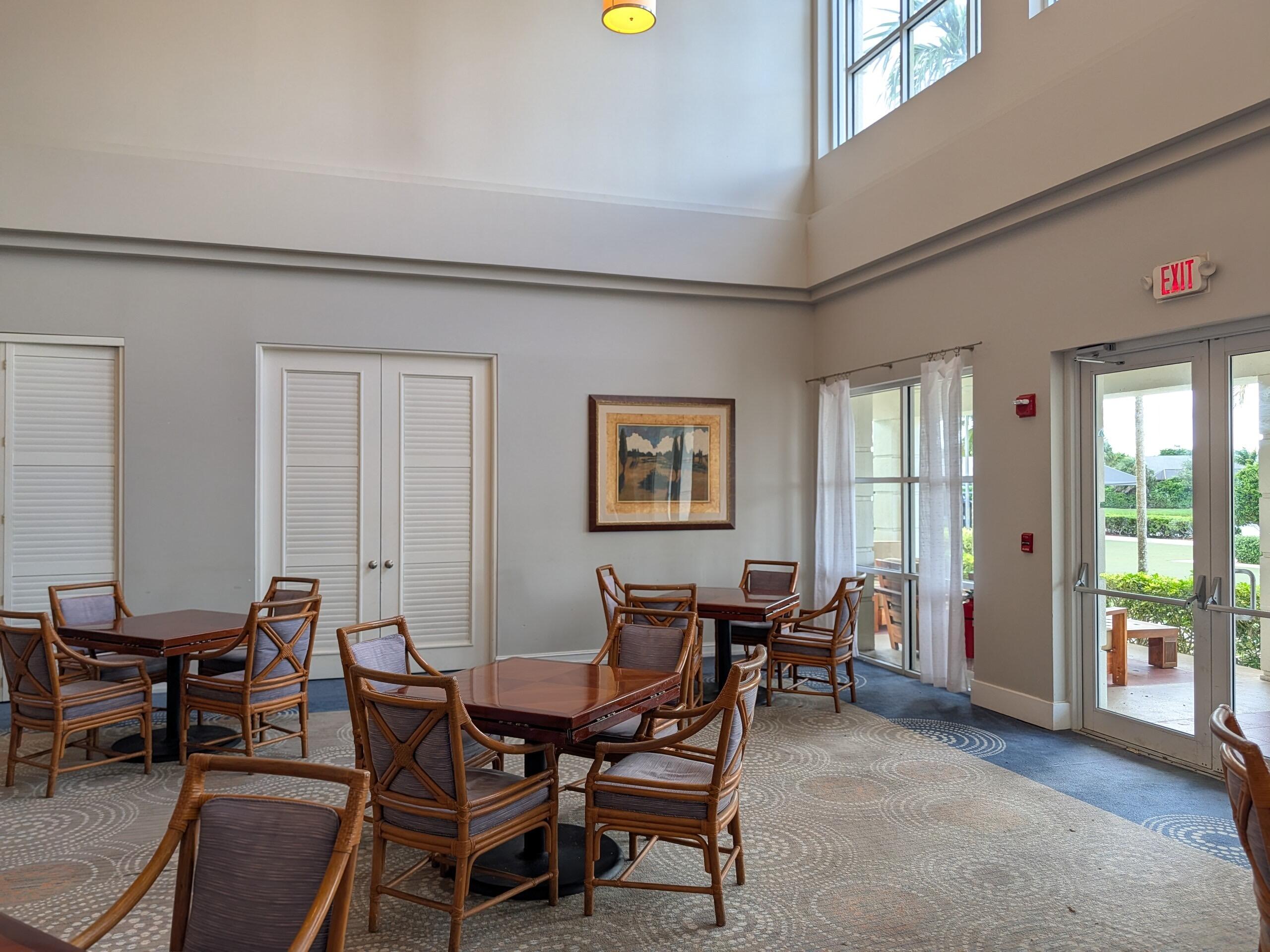 17372 Boca Club Boulevard, Unit 405 Boca Raton, FL 33487 - Photo 68 of 74 a view of a dining room with furniture and chandelier