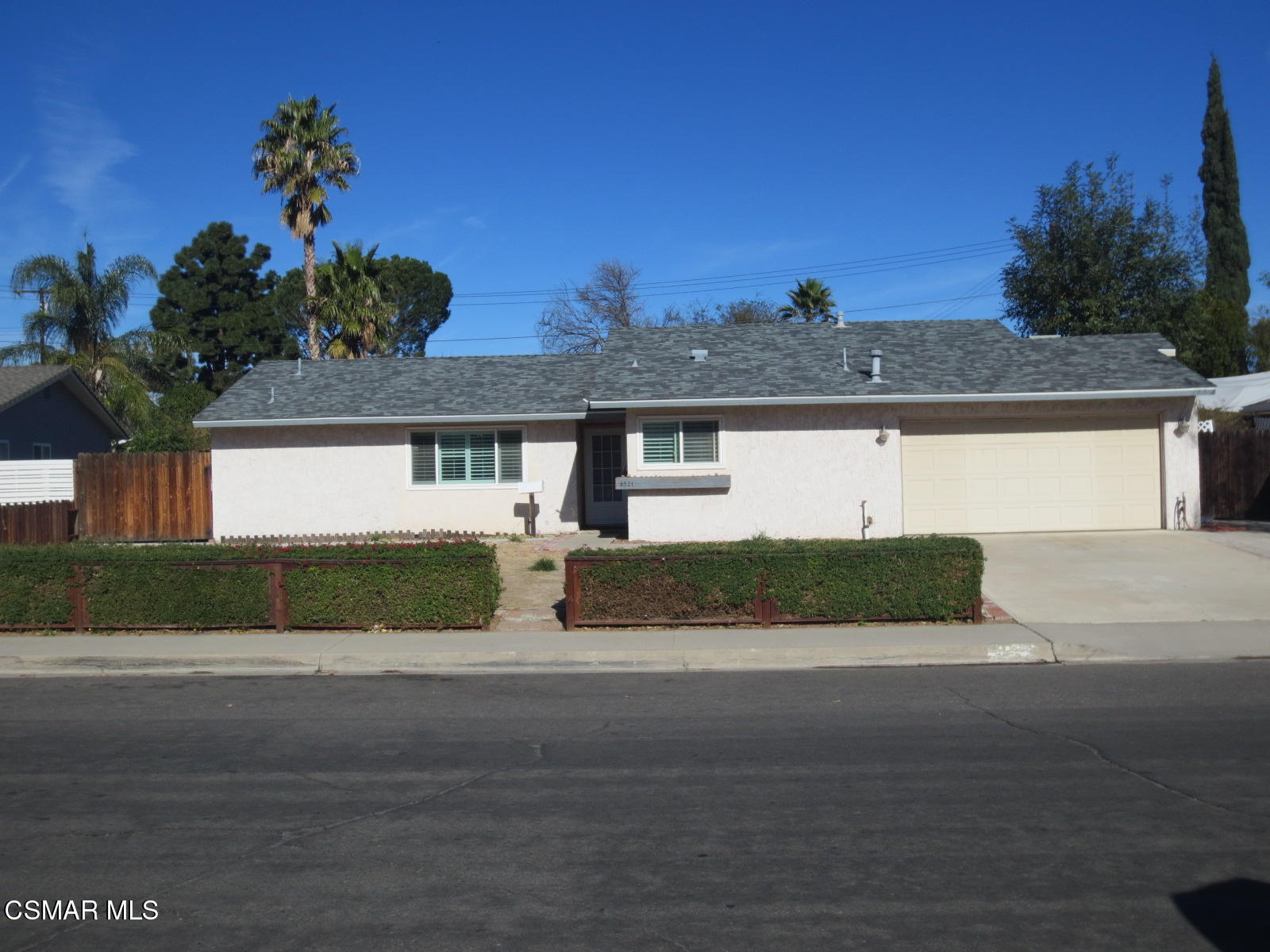 4521 Alpine Street Simi Valley, CA 93063 - Photo 1 of 62 a front view of a house with a yard and garage