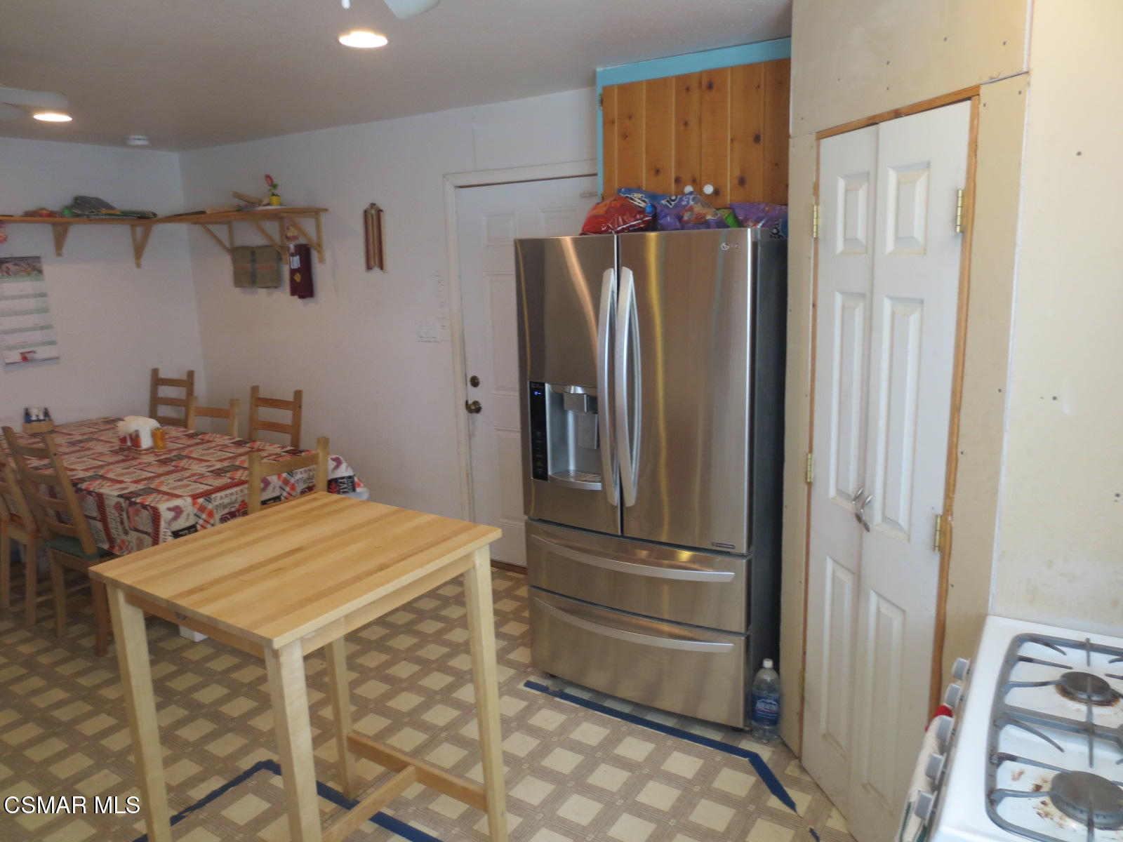 4521 Alpine Street Simi Valley, CA 93063 - Photo 13 of 62 a kitchen with a refrigerator and a stove top oven