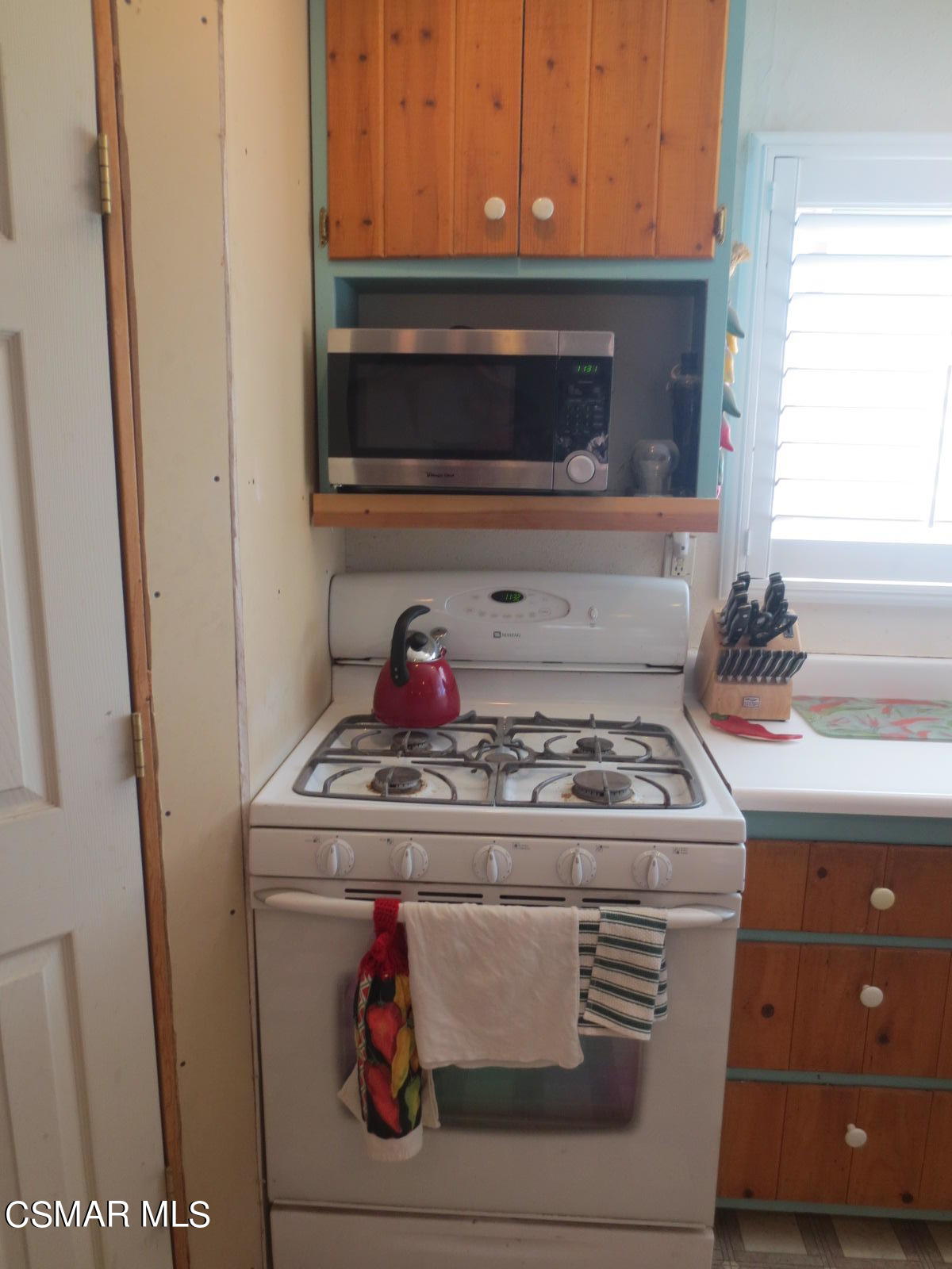 4521 Alpine Street Simi Valley, CA 93063 - Photo 15 of 62 a stove top oven sitting inside of a kitchen