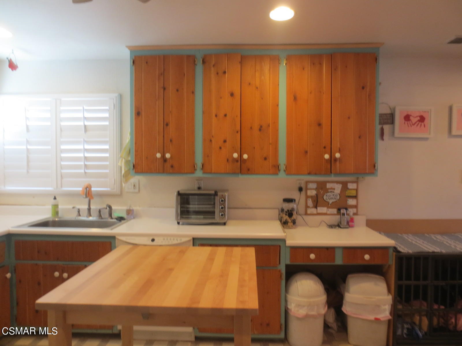 4521 Alpine Street Simi Valley, CA 93063 - Photo 18 of 62 a kitchen with a sink cabinets and window