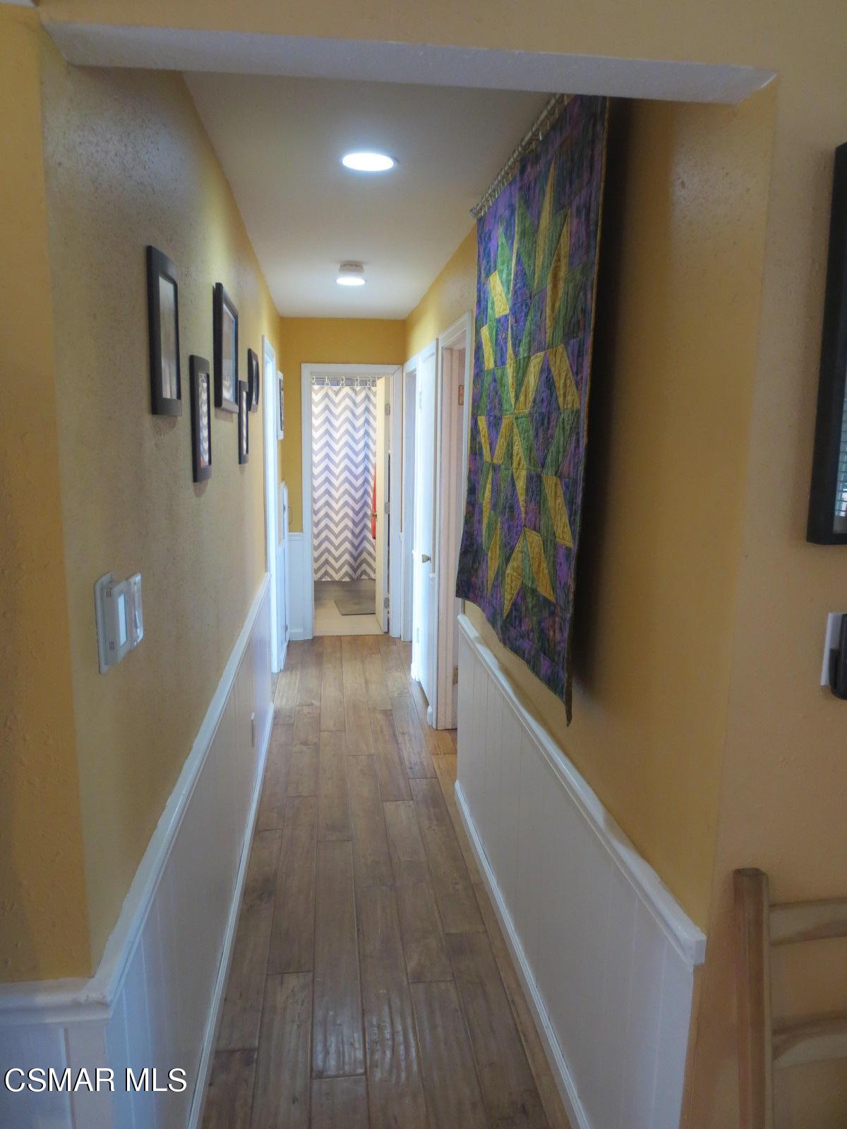 4521 Alpine Street Simi Valley, CA 93063 - Photo 19 of 62 a view of a hallway with wooden floor
