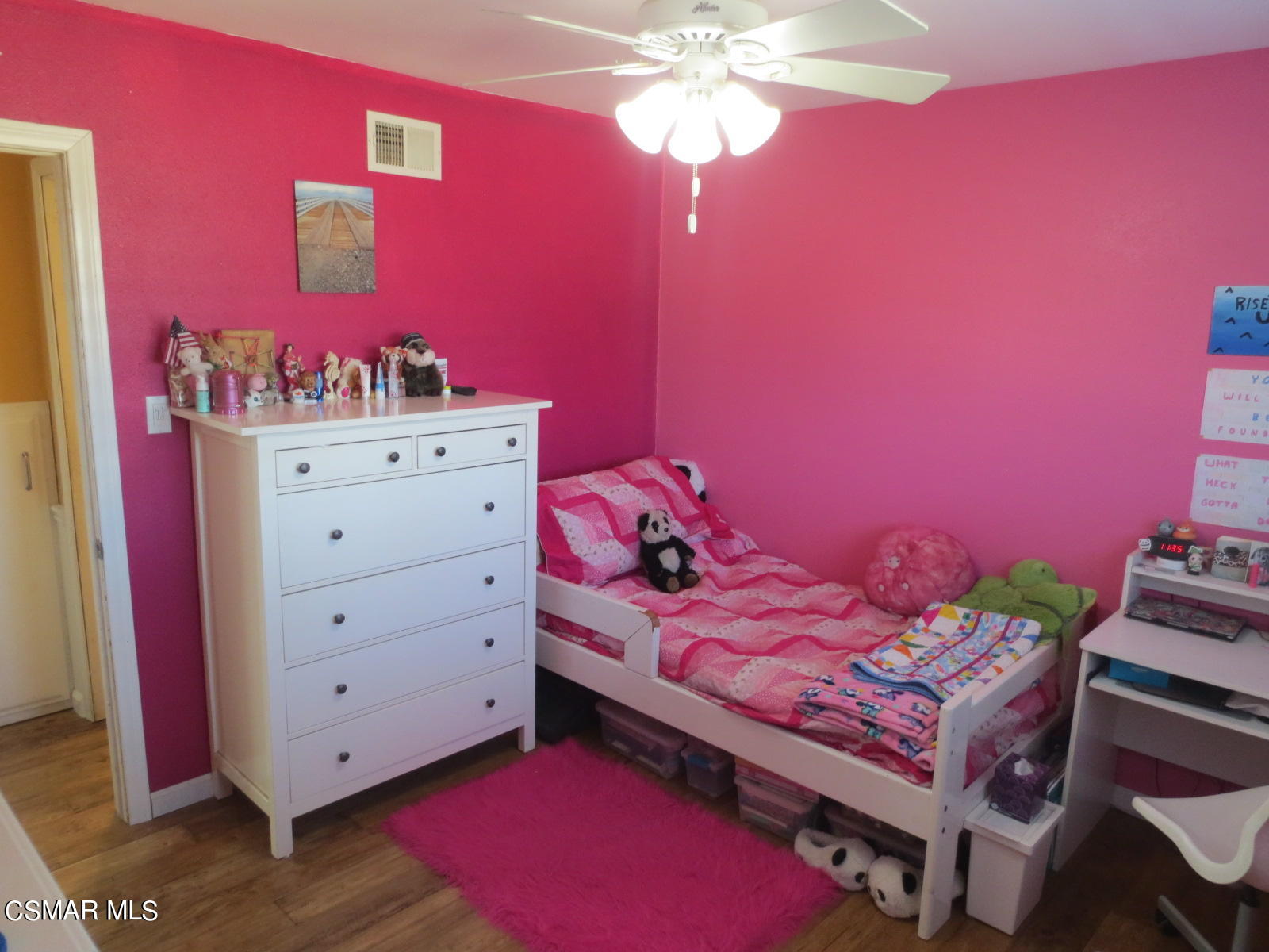 4521 Alpine Street Simi Valley, CA 93063 - Photo 24 of 62 a bedroom with a bed and a chandelier