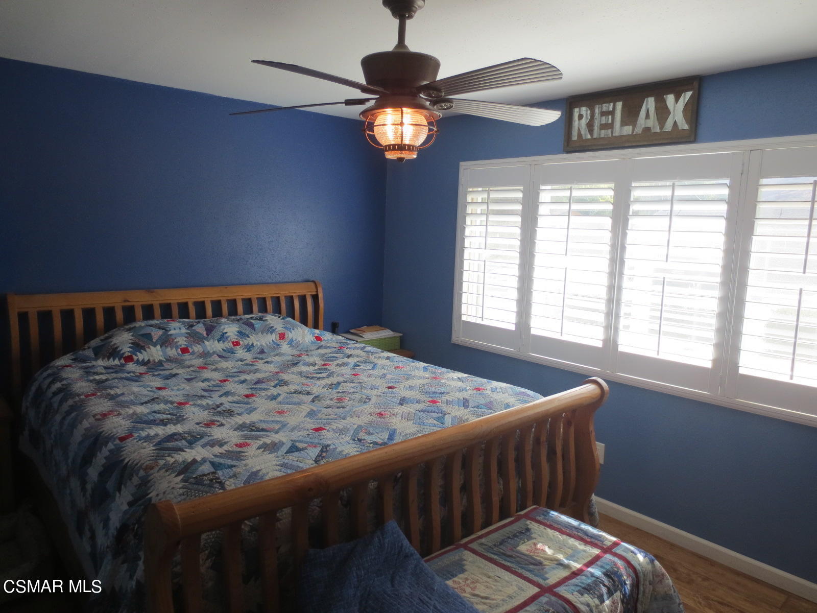 4521 Alpine Street Simi Valley, CA 93063 - Photo 34 of 62 a bed sitting in a bedroom next to a window