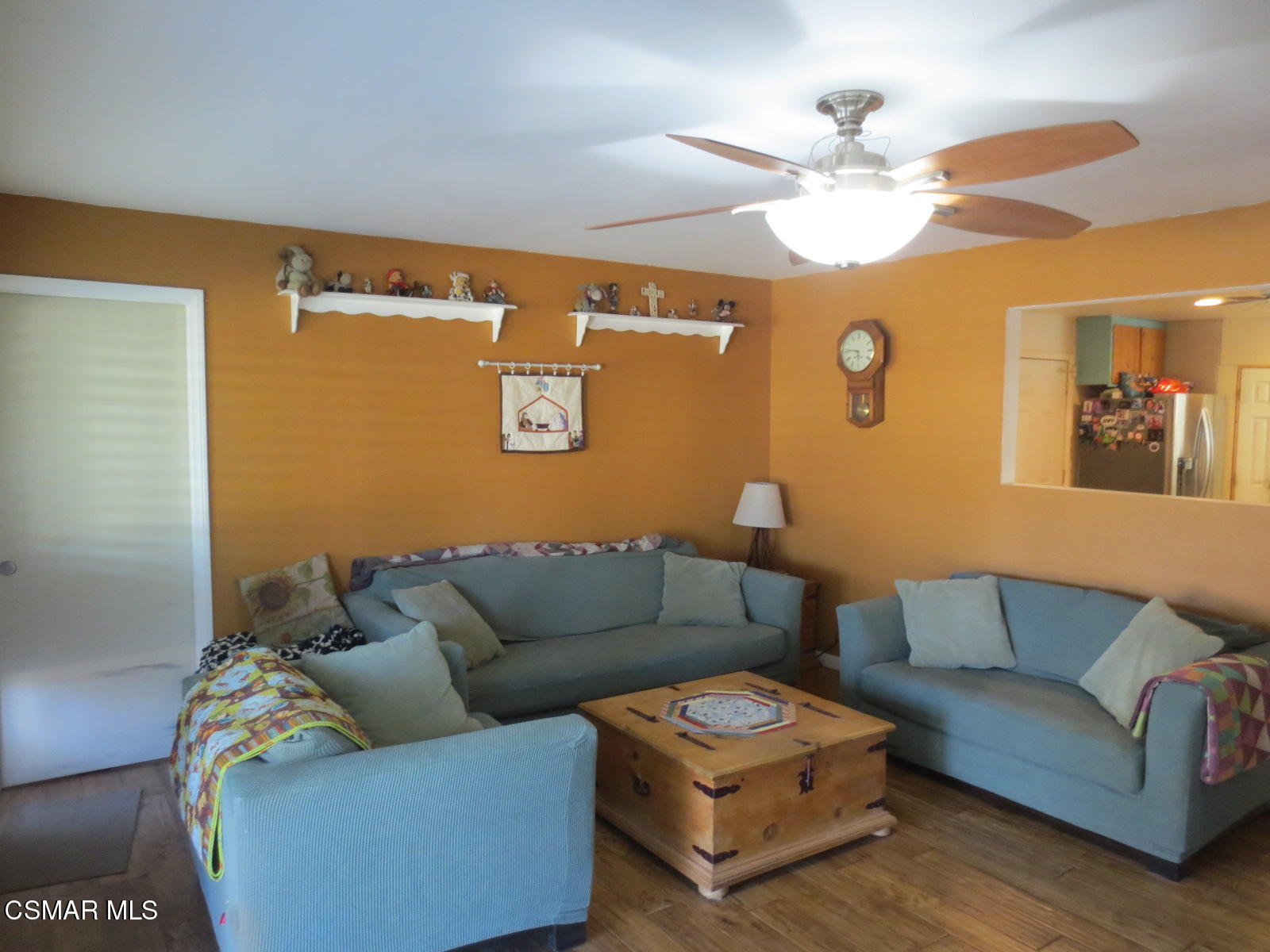 4521 Alpine Street Simi Valley, CA 93063 - Photo 44 of 62 a living room with furniture and a chandelier
