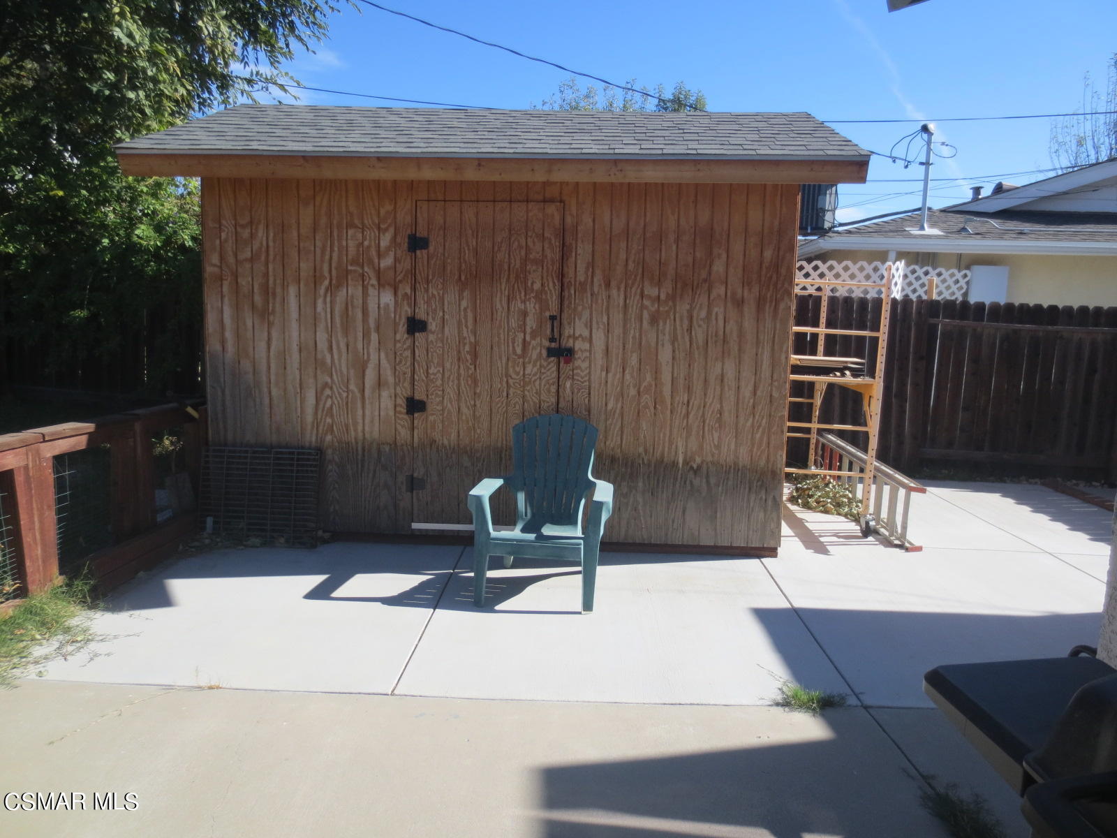 4521 Alpine Street Simi Valley, CA 93063 - Photo 49 of 62 a wooden bench sitting in front of a building