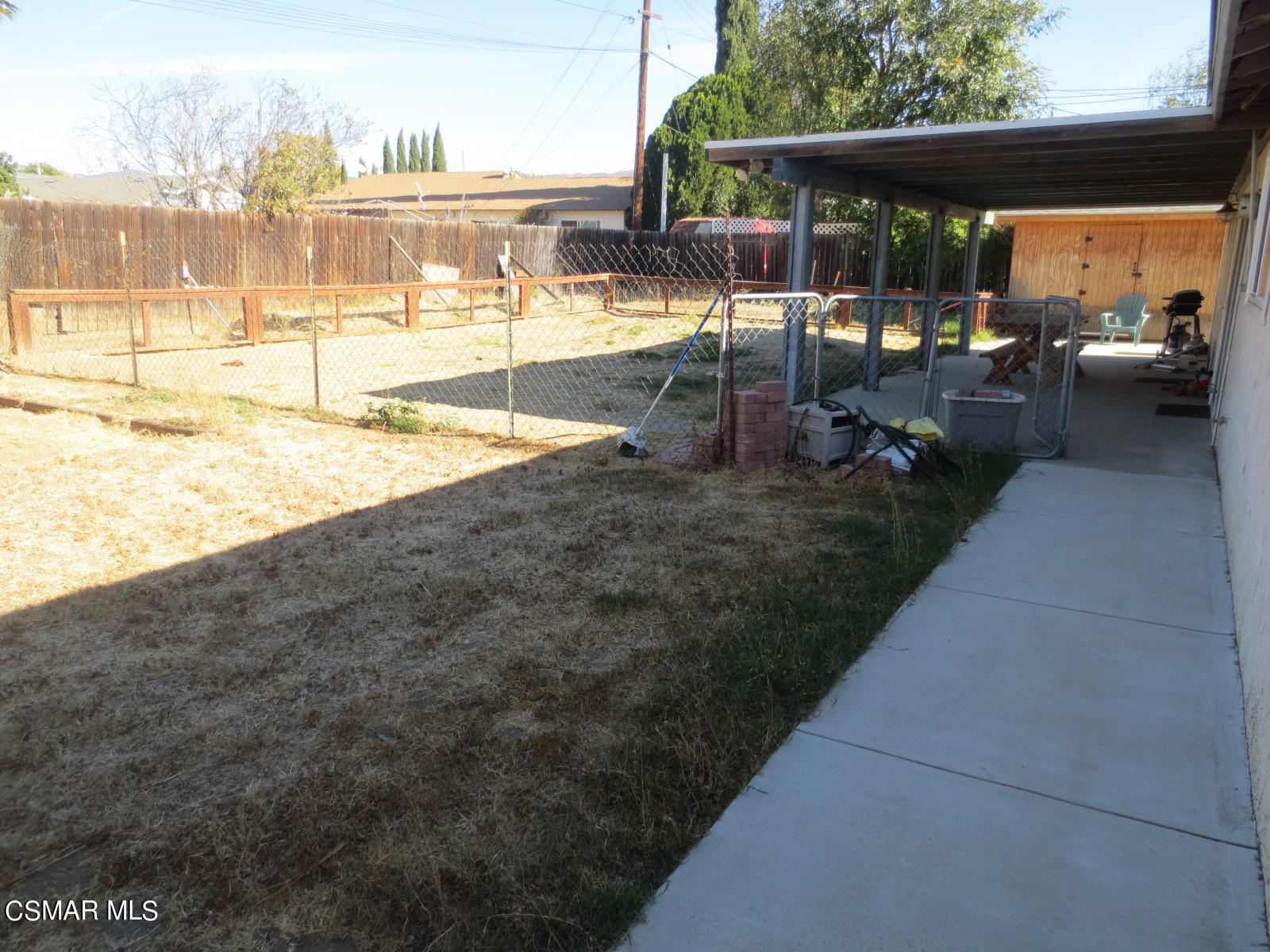 4521 Alpine Street Simi Valley, CA 93063 - Photo 59 of 62 a view of a swimming pool with outdoor seating and a yard