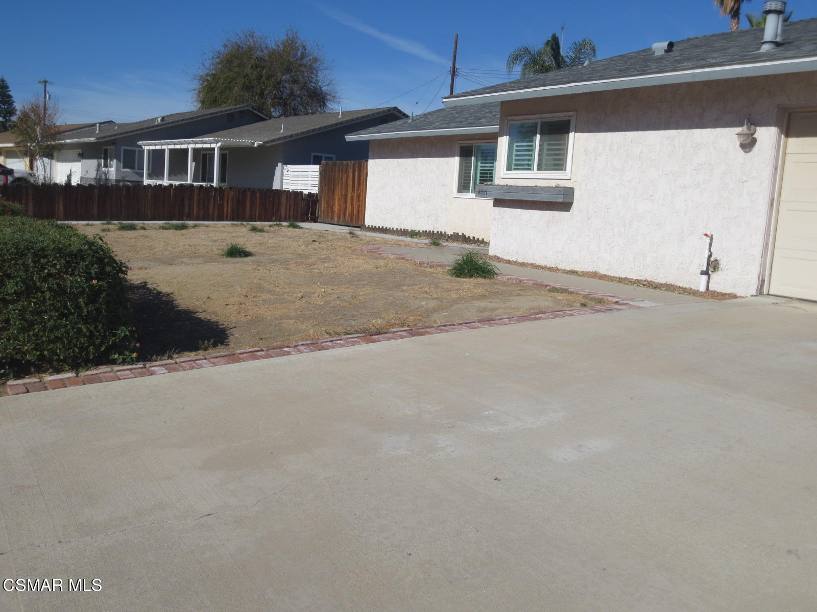 4521 Alpine Street Simi Valley, CA 93063 - Photo 7 of 62 a front view of a house with a yard