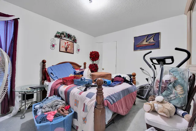 a bed room with a bed and a couch