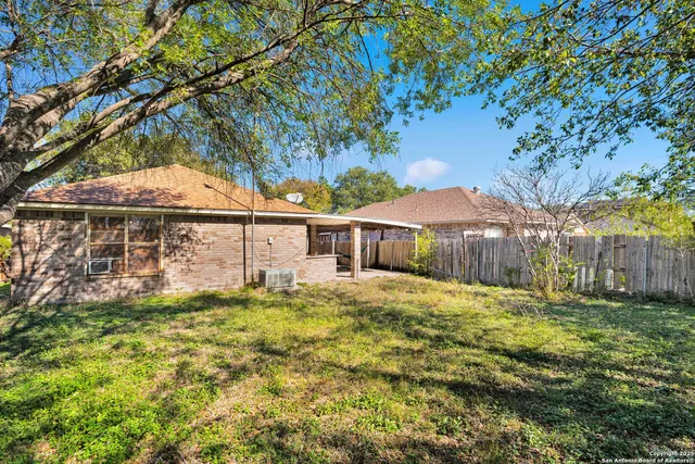 a house view with swimming pool in front of it