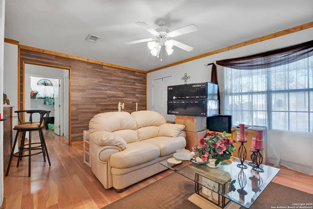 a work room with furniture and wooden floor