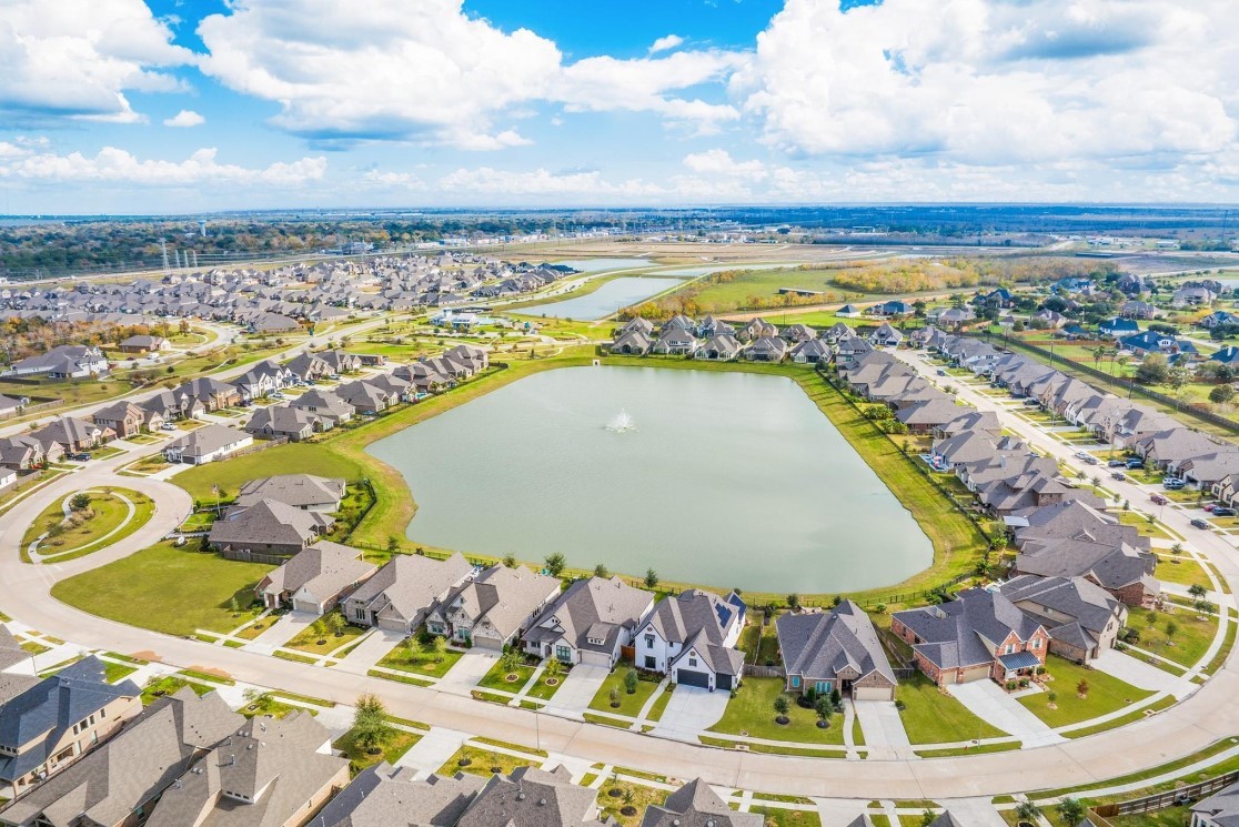 31527 Fern Grove Road Fulshear, TX 77423 - Photo 20 of 21 a view of a swimming pool with a lounge chair
