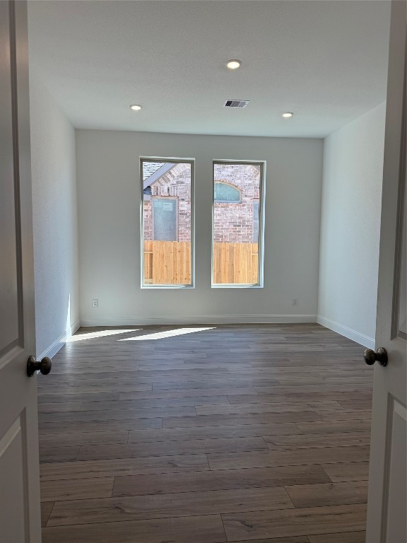 31527 Fern Grove Road Fulshear, TX 77423 - Photo 3 of 21 a view of an empty room with wooden floor and a window