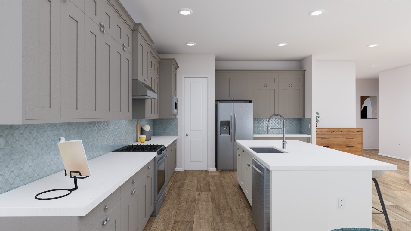 31527 Fern Grove Road Fulshear, TX 77423 - Photo 6 of 21 a kitchen that has a sink and a stove in it