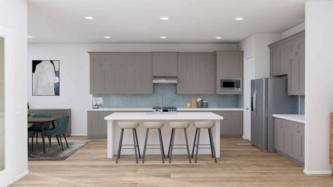 31527 Fern Grove Road Fulshear, TX 77423 - Photo 7 of 21 a kitchen with stainless steel appliances a sink a stove a refrigerator and cabinets