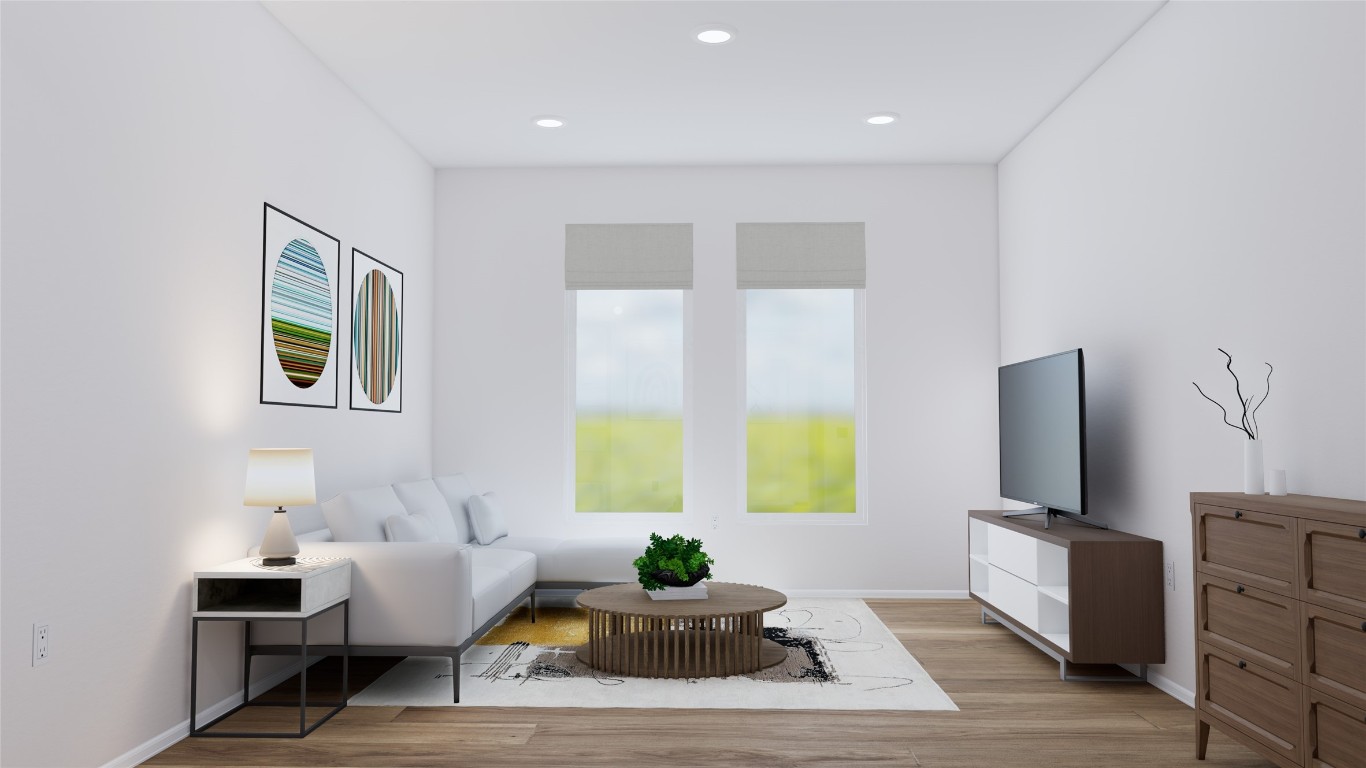 31527 Fern Grove Road Fulshear, TX 77423 - Photo 8 of 21 a living room with furniture wooden floor and a flat screen tv